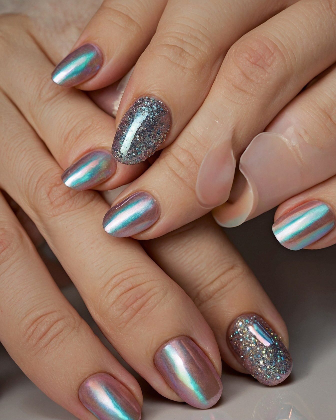 Chrome and Silver Glitter Oval Nail Arrangement