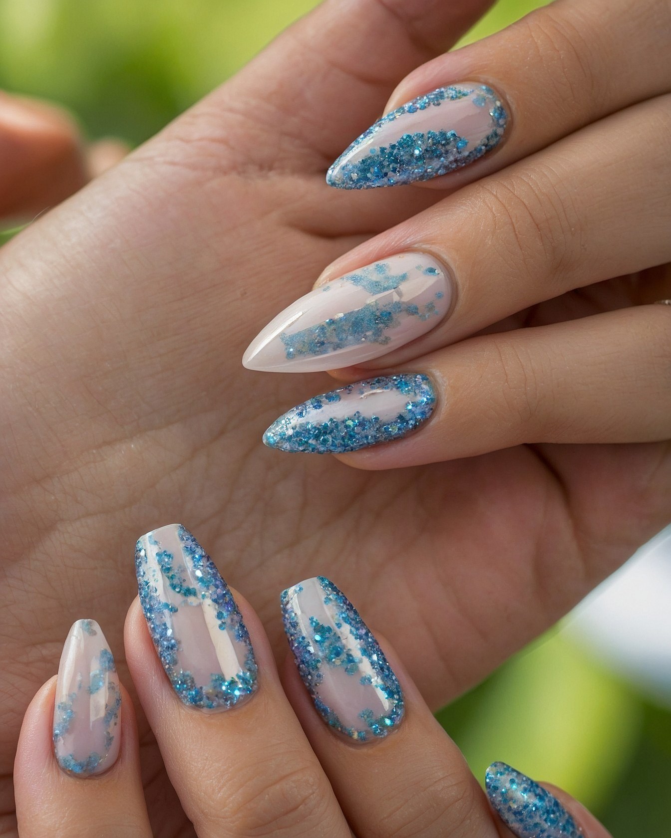 Close-up of Pastel Nails with Azure Glitter Accents