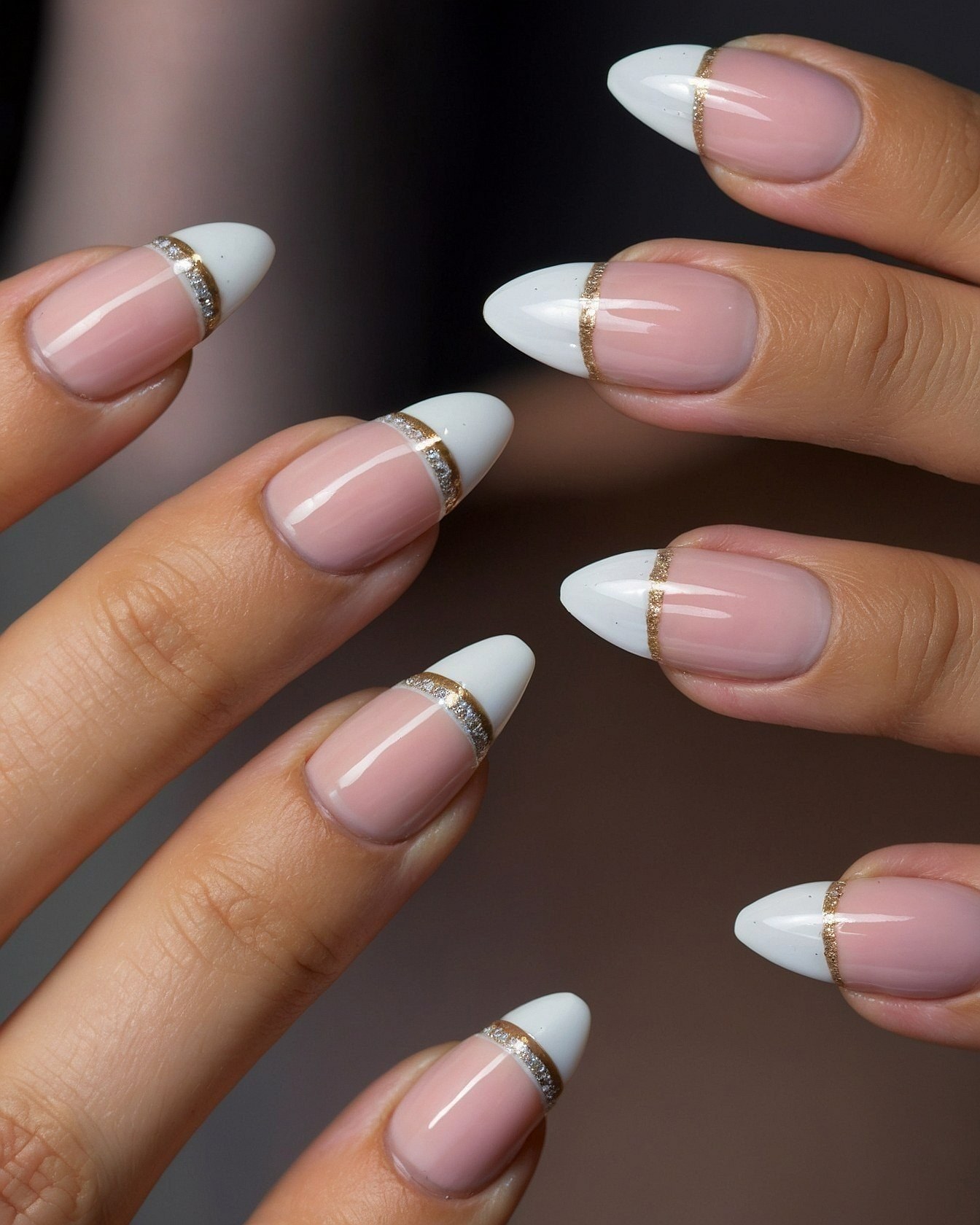 Almond French tips with gold and glitter accents