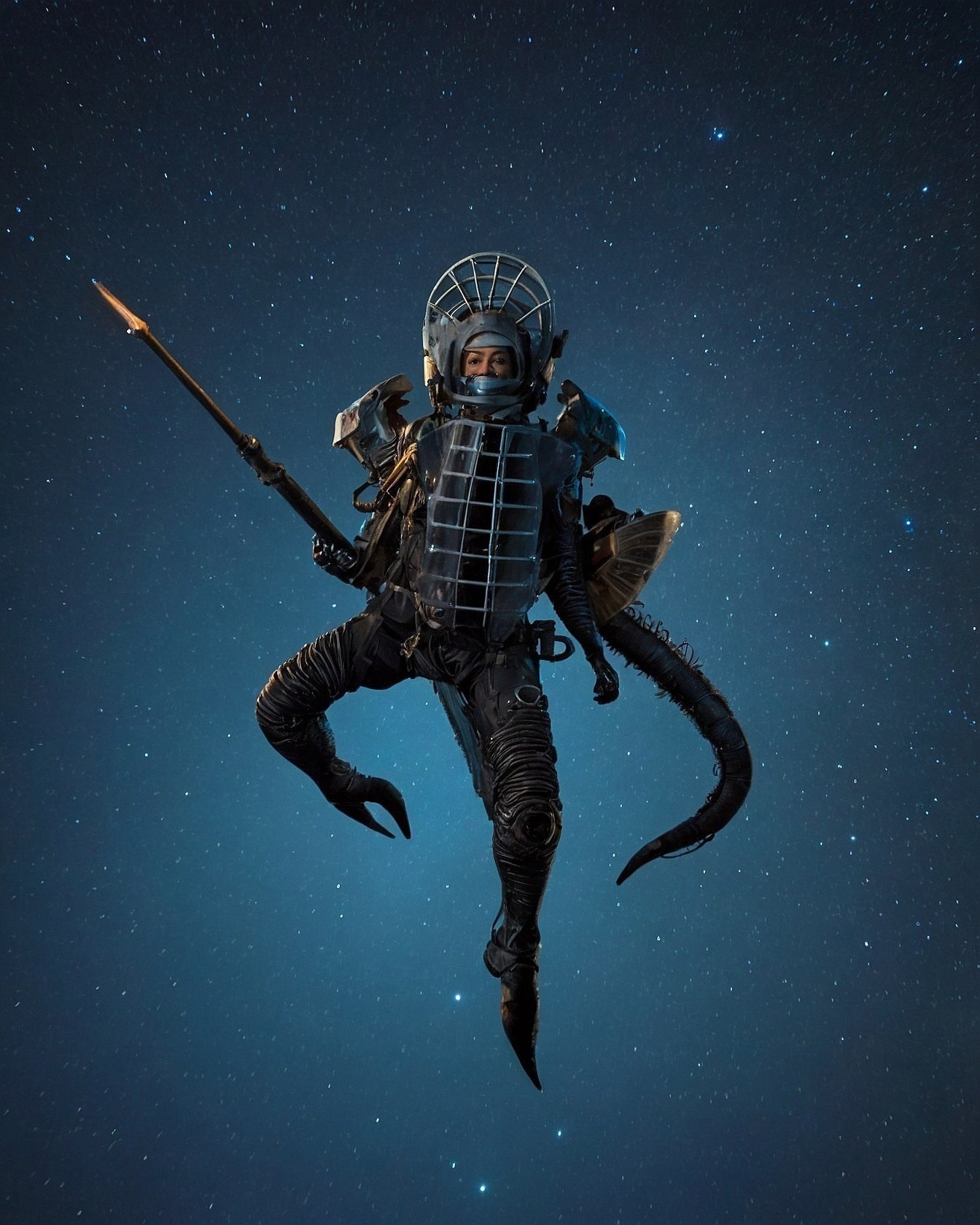 A Diver in Ornate Metallic Armor Hovering Against a Starry Night Sky