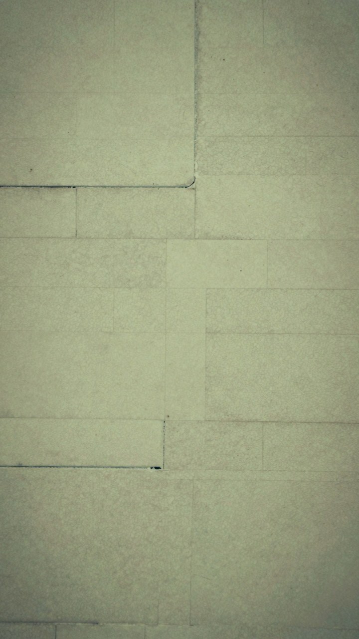 Applying Clean Block Tile Patterns to Sage Green Walls