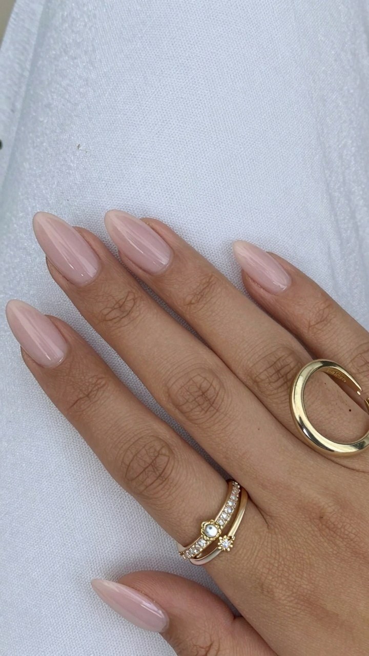 Maintaining Glossy Neutral Pink Almond Nails All Season