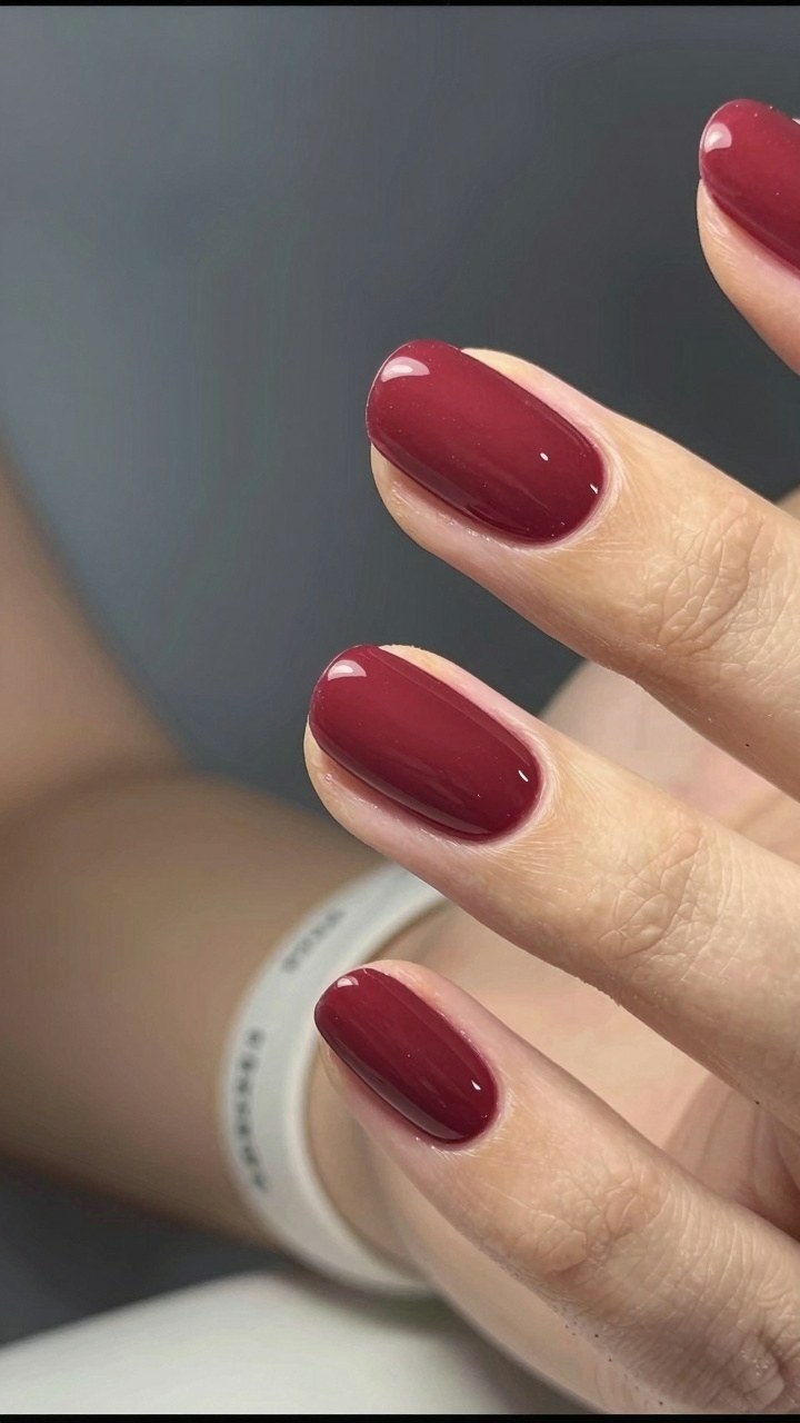 Maintaining Long Almond Nails with Deep Wine Polish