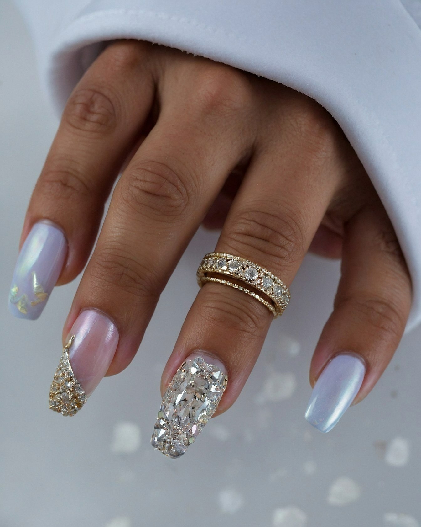 Dramatic Metallic and Gemstone Contrast on Almond Nails