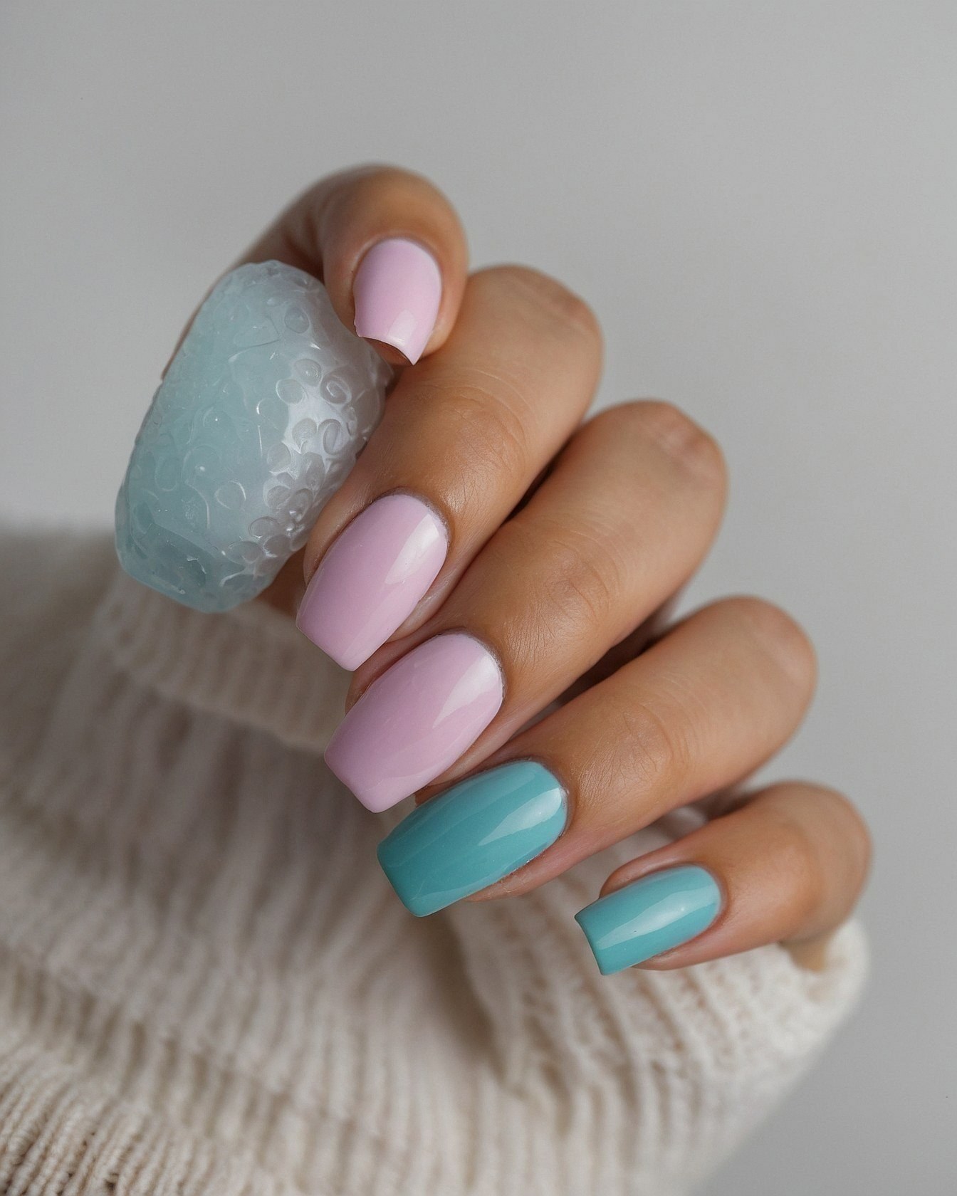 Soft Pink and Teal Contrast Nails with Textured Stone