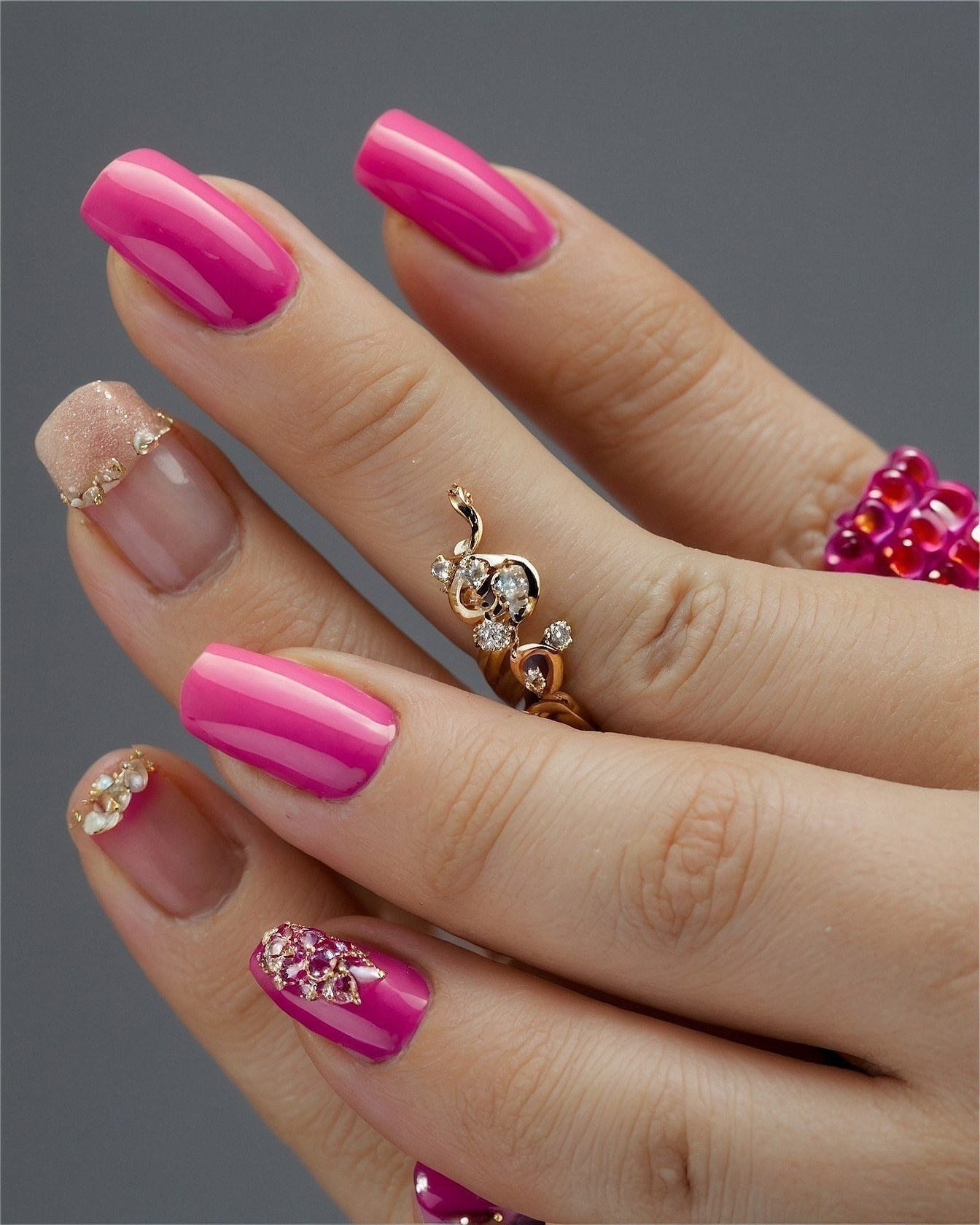 Chic Pink Nails with Dazzling Gemstone Accents