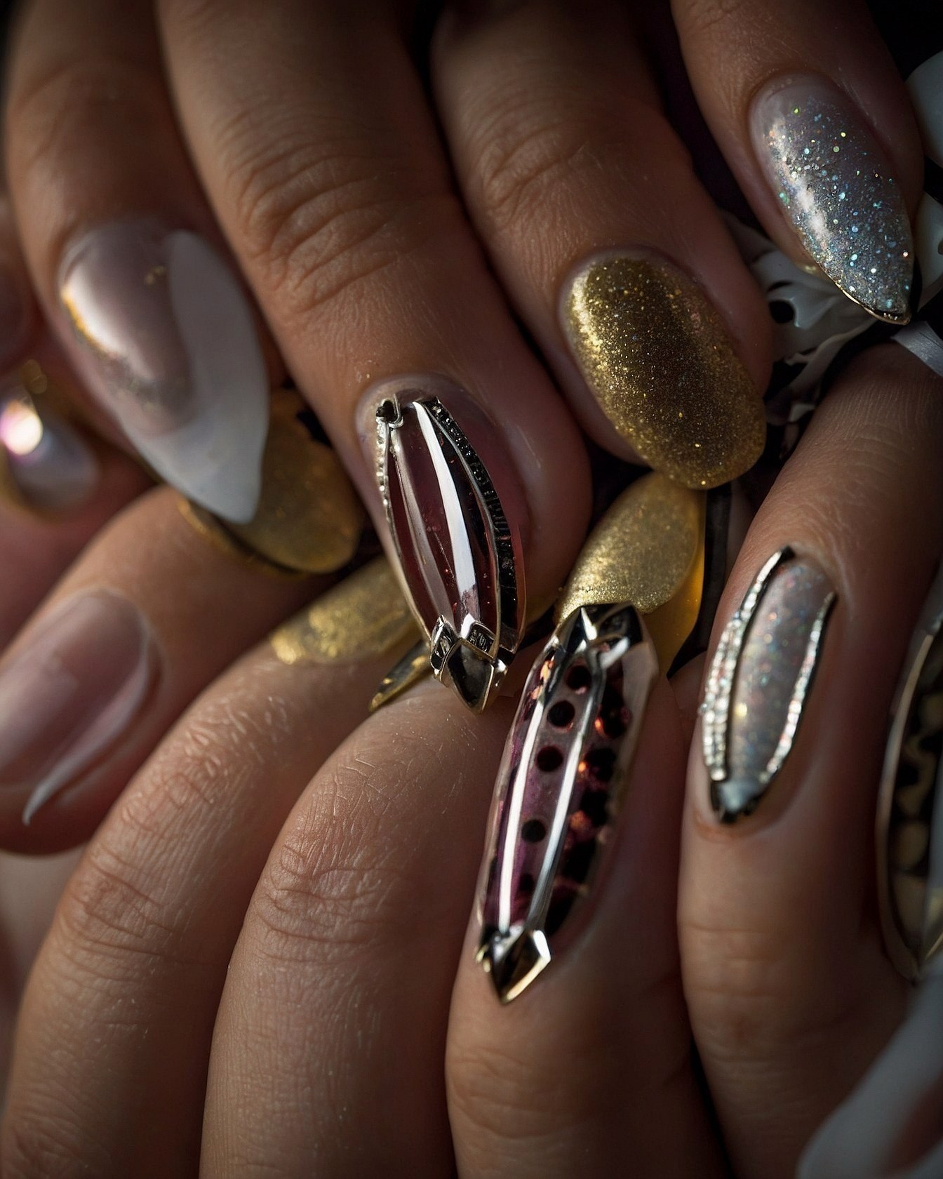 Geometric Accents and Glittering Finishes on Almond Nails