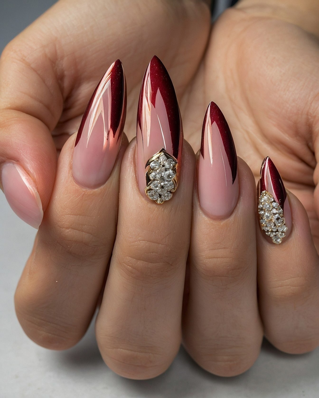Close-up of Almond Nails with Deep Red Ombre Glitter