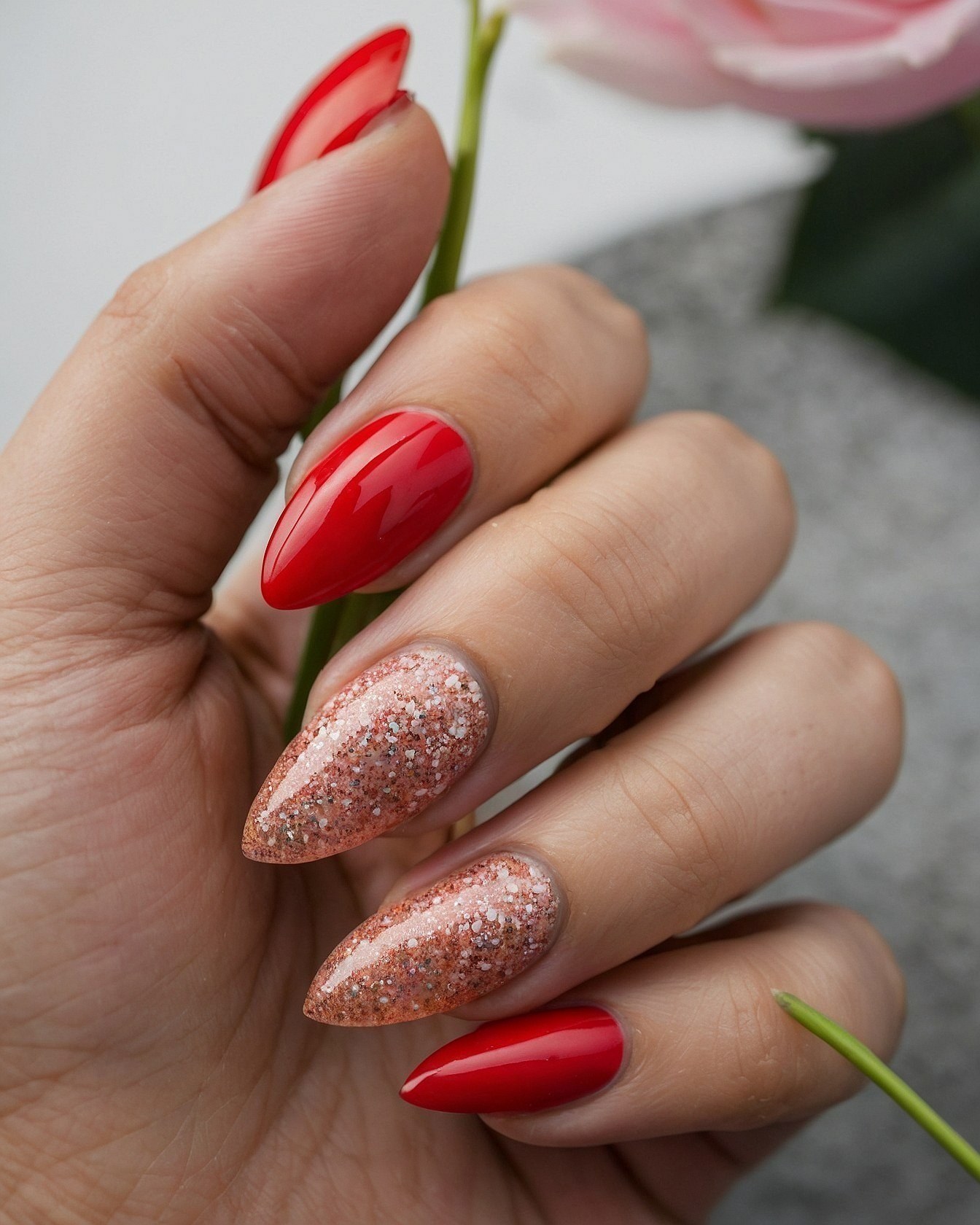 Juxtaposed Glossy Red and Glittering Nude Almond Nails