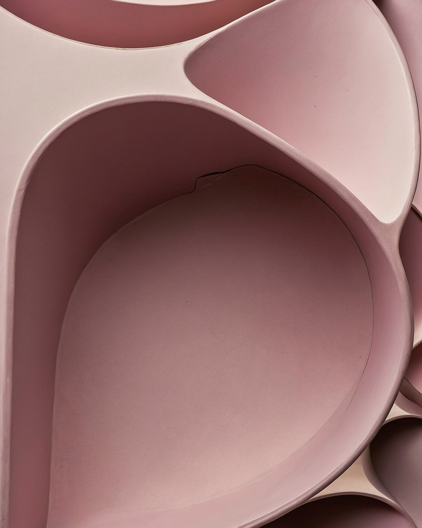 Sculptural Pink Forms Meet Curving Softness