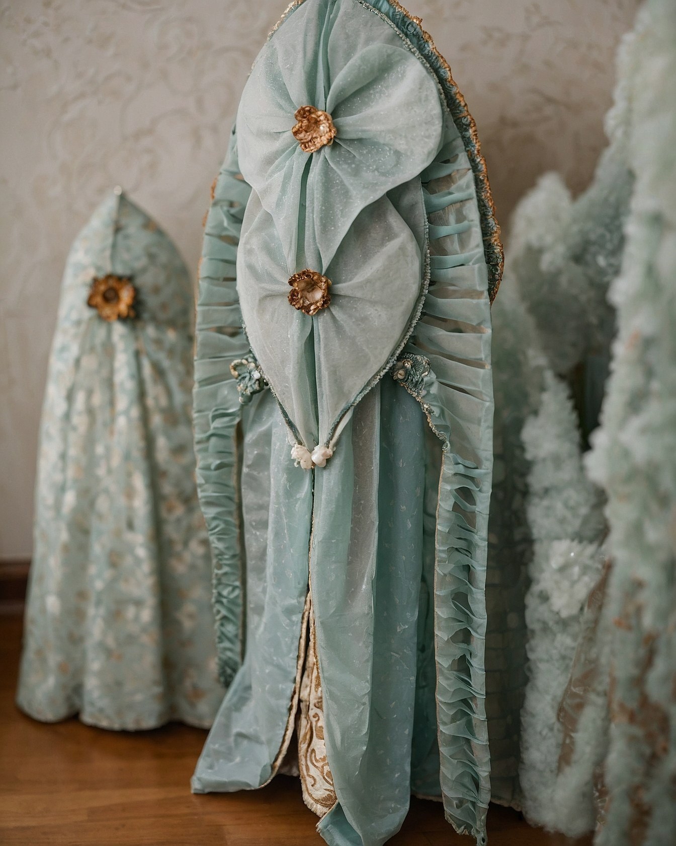 Ruffled chiffon layers against ornate brocade