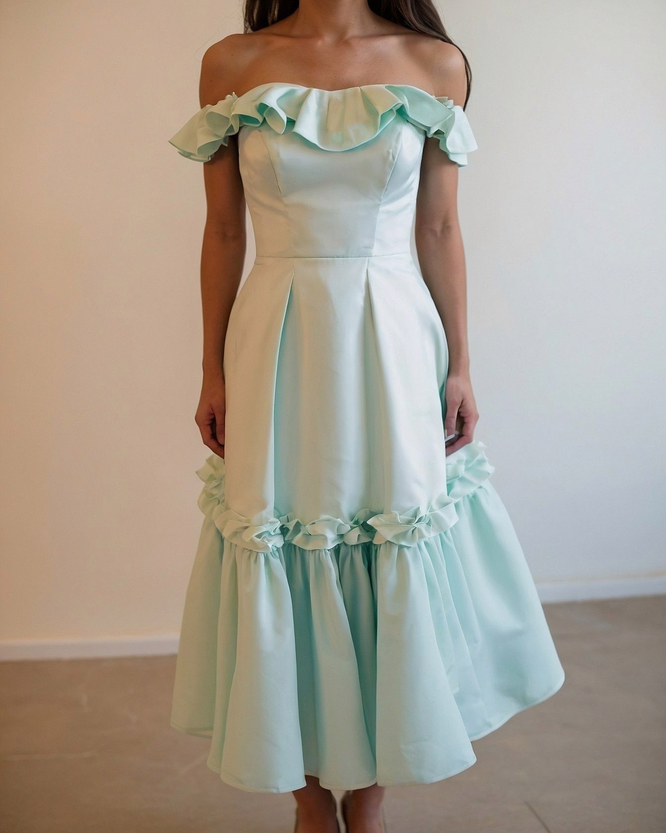Structured Bodice Meets Flowing Ruffle Hemline