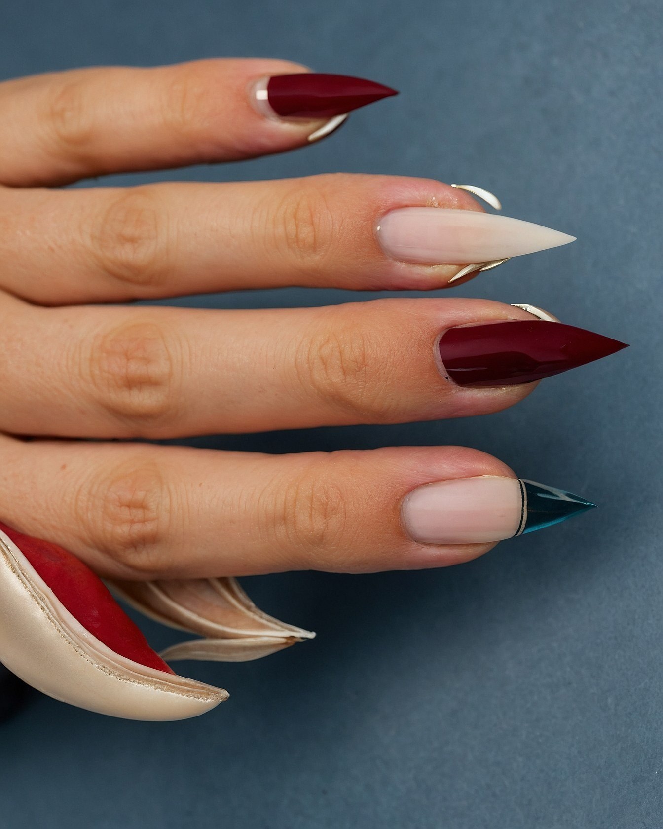 Sharp Nails Contrast with Soft Petals and Satin