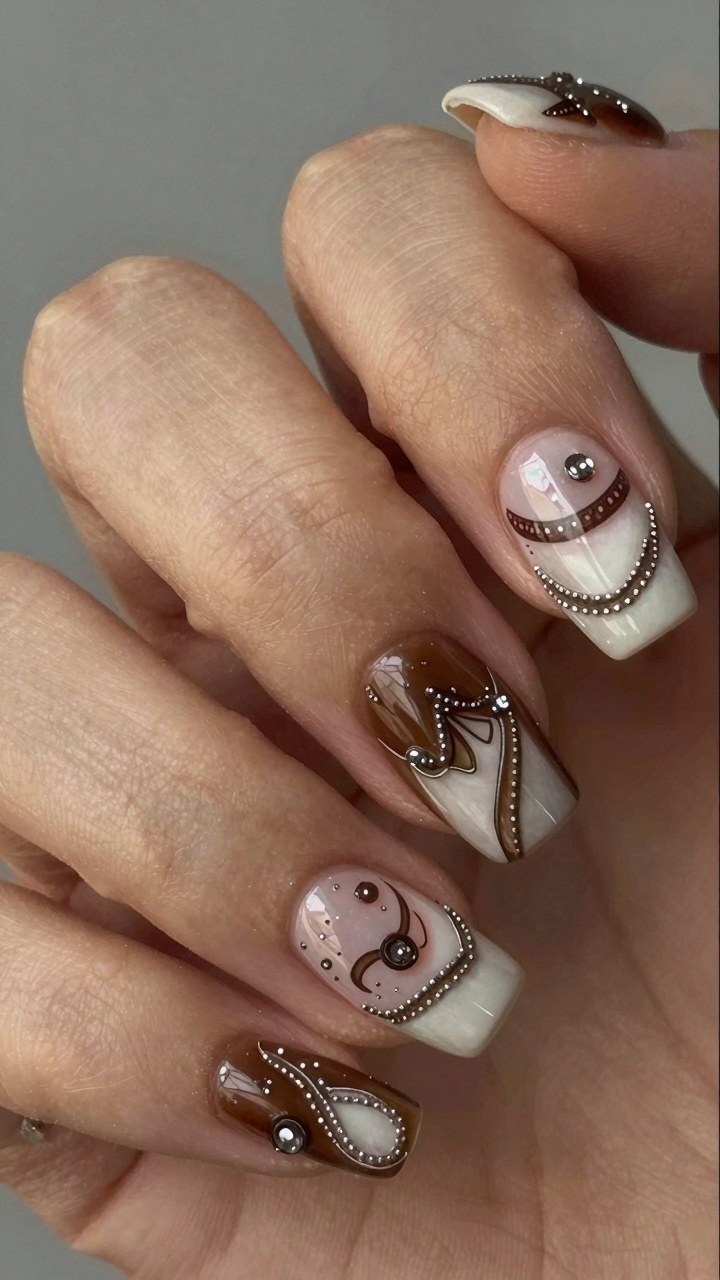Adding Metallic Stud Details to Brown Swirl Nail Art