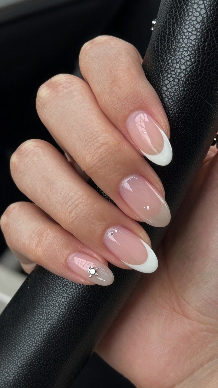 Adding Rhinestone Details to Burgundy Dot Nails