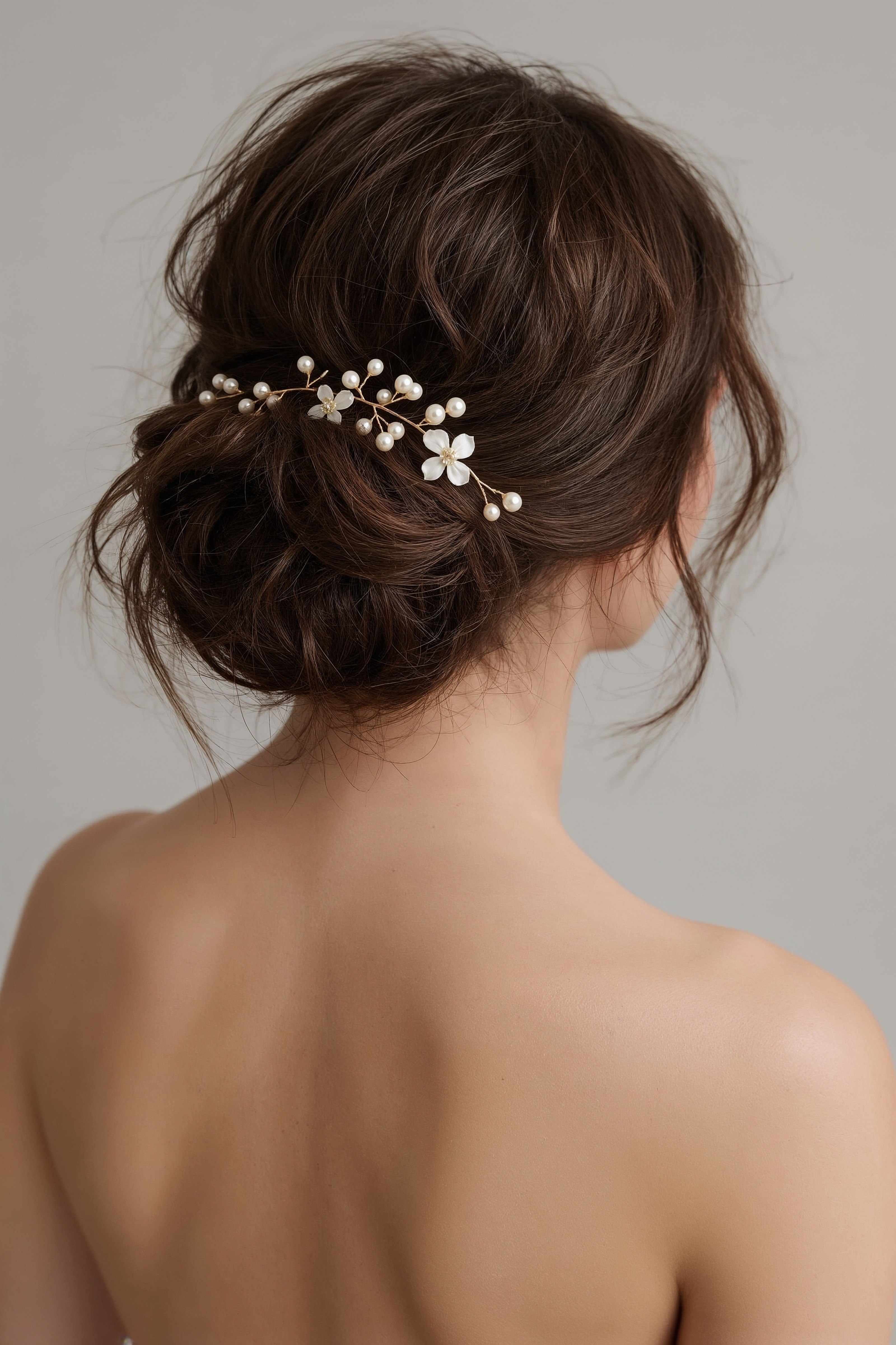 Romantic Bridal Updo: Effortless Wedding Day Bun with Floral Accents