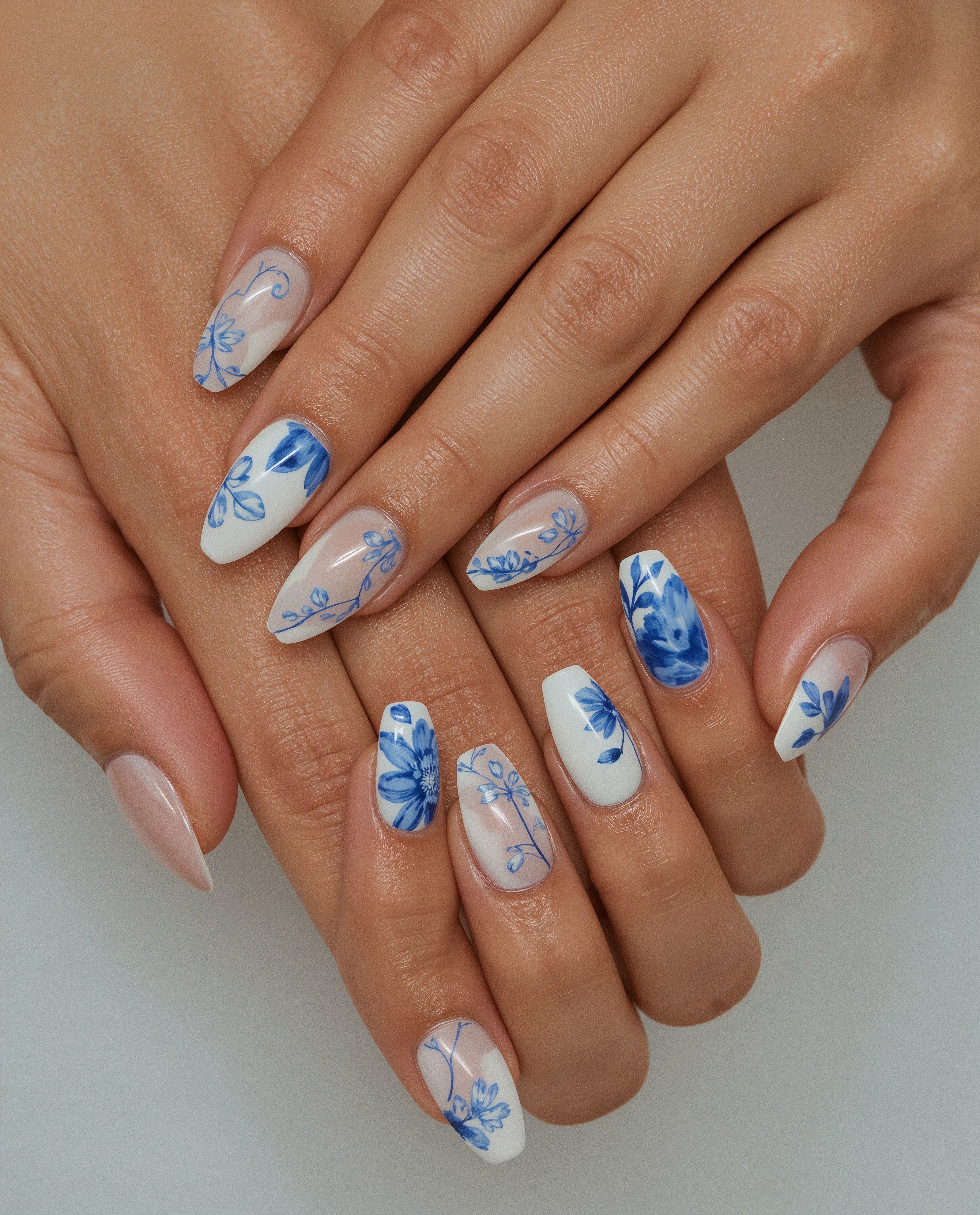 Elegant Blue Porcelain Art: Easy Gel Nail Designs for White Almond Nails
