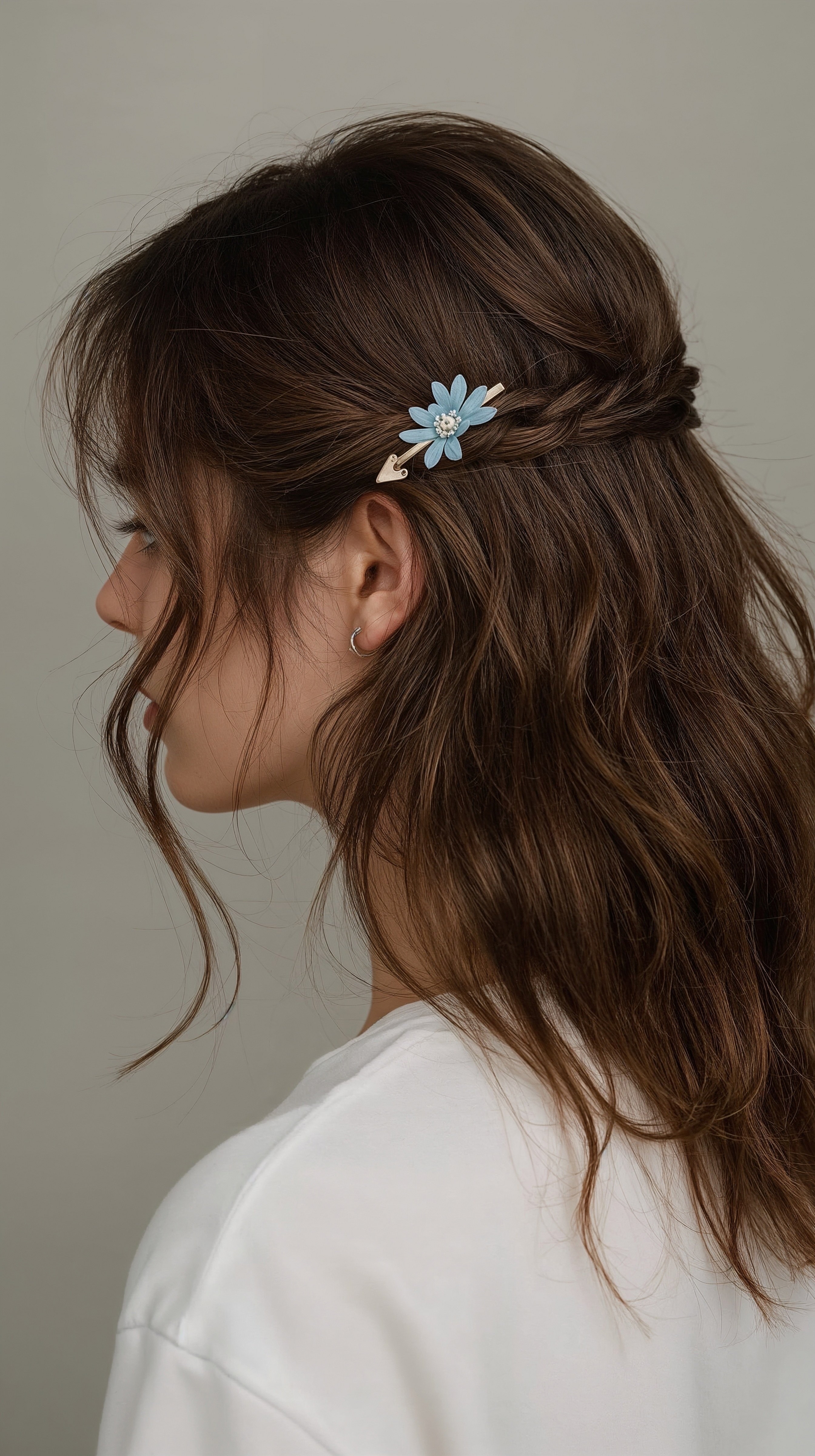 Elegant Braided Updo with Flower Clip: Chic Long Hair Style
