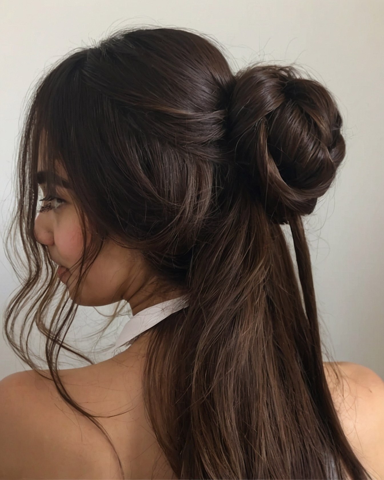 Half-Up Bun with Loose Tendrils