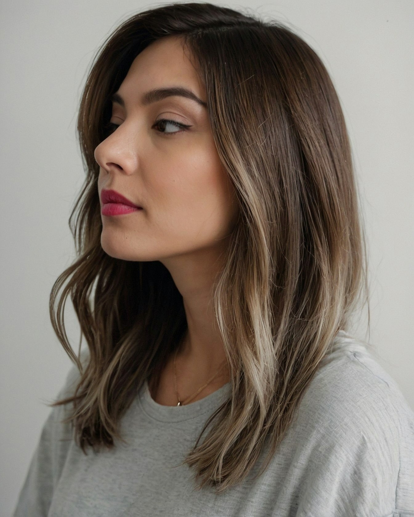 Profile View of Mid-Length Waves with Subtle Blonde Balayage